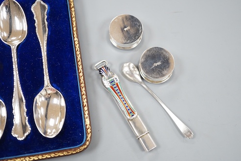 A cased set of six silver teaspoons, a silver bread knife, two 925 pill boxes, an 800 and enamel 'Tutankhamun' pencil case and a silver condiment spoon.